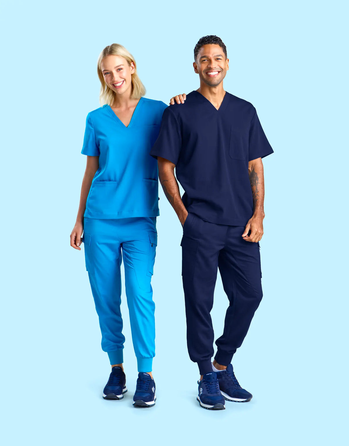 Two healthcare professionals wearing lightweight, durable scrubs made from FlexStretch fabric, designed for all-day comfort, flexibility, and modern style.