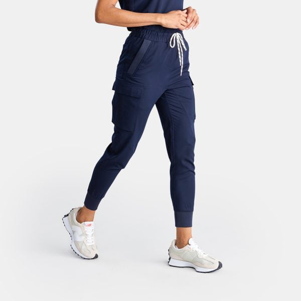 Side View of Women Wearing the Unisex Cargo Jogger Scrub Pant in Twilight/navy by Designs to You
