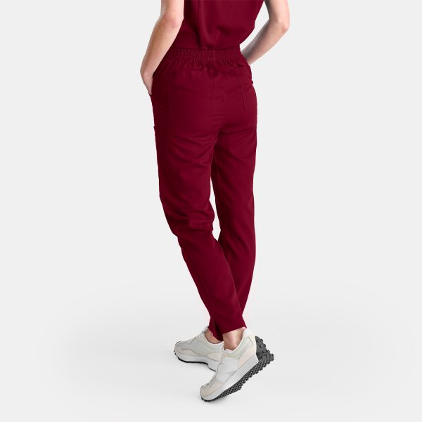 Female Healthcare Professional in Vibrant Sangria Red Straight Leg Scrubs Pants, Embodying Confidence and Competence.