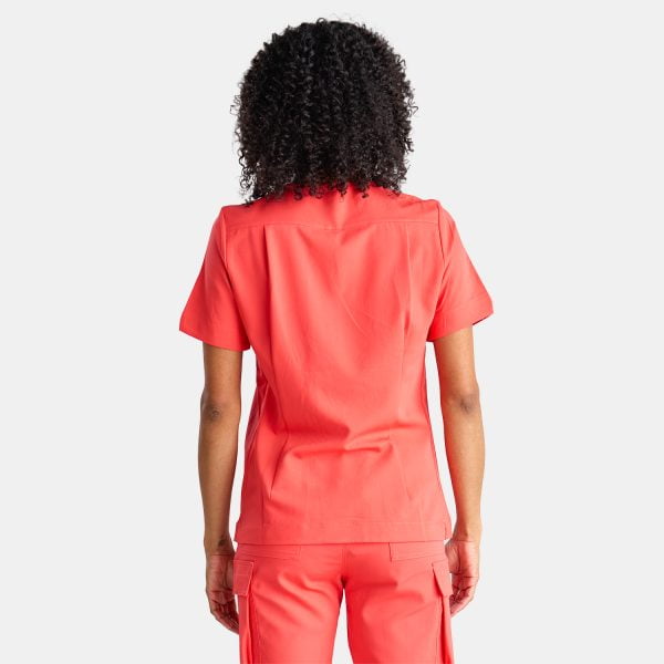 Back View of a Woman Wearing the Designs to You Watermelon Scrubs. the Vibrant Watermelon Colour Adds a Pop of Freshness to the Uniform, While the Comfortable Fit Ensures Ease of Movement Throughout the Day. the Image Highlights the Stylish Design and High-quality Construction of the Scrubs, Making Them a Great Choice for Healthcare Professionals.
