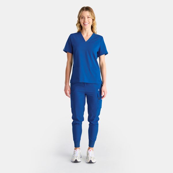 Full Body Image of a Woman in Medical Scrubs Top Featuring Three Spacious Pockets for Healthcare Essentials