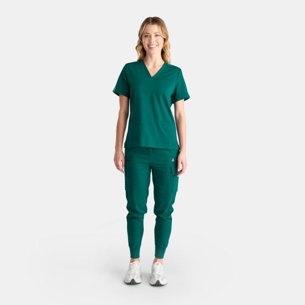 Full Body View Woman Wearing the Designs to You Fern Green Scrubs. the Sleek Green Colour Adds a Touch of Elegance to the Uniform, While the Comfortable Fit Allows for Ease of Movement. the Image Showcases the Modern Design and Attention to Detail of the Scrubs, Making Them a Perfect Choice for Healthcare Professionals Seeking Both Style and Functionality.