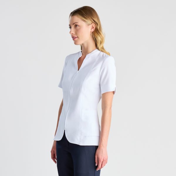 a Side View of a Woman in a Professional White Zip Front Pharmacy Tunic with a Mandarin Collar, Short Sleeves, and a Sleek Silhouette Against a Light Background.