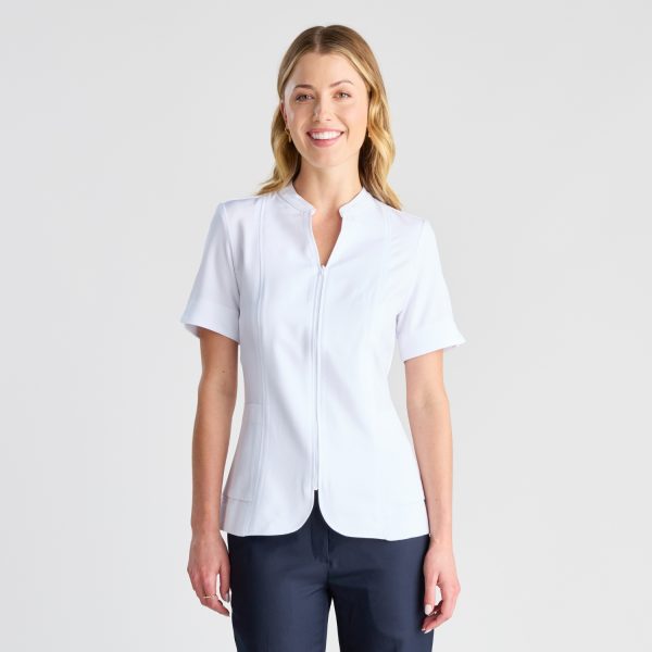 a Woman in a White Pharmacy Tunic Smiles Gently, Featuring a Zip Front and Structured Fit That Provides Both Style and Function in Healthcare Settings.