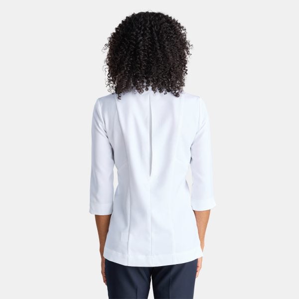 Rear View of a Woman Wearing a White Asymmetric Pharmacy Jacket with 3/4 Sleeves.