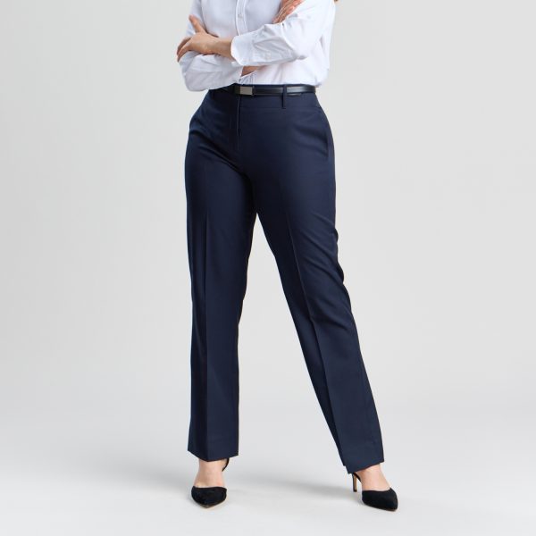 Front View of the Relaxed Leg Pant in French Navy, Showcasing a Fit That Combines Ease and Elegance. the Pants Are Styled with a Classic White Button-up Shirt and a Black Belt, Highlighting the Garment's Versatility.