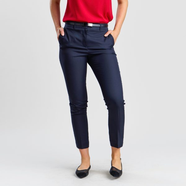 Front-on View of Women's Slim Style Chino Pant in French Navy, Emphasising the Tailored Fit and Cropped Length, Complemented by a Red Blouse and Black Flats for a Chic Look.