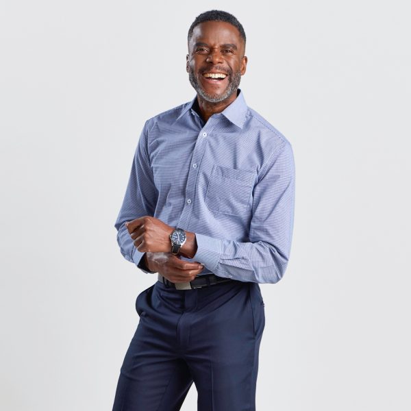 a Cheerful Man Wearing a Men's Slim Fit Long Sleeve Shirt in Navy Mini Check, with Hands Clasped and a Watch Visible, Illustrating the Shirt's Professional and Stylish Design.