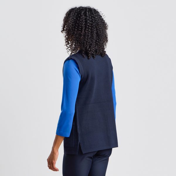 Rear View of a Women's Milano Knit Button Front Vest in French Navy, Highlighting the Structured Fit and Contrasting Blue Top Underneath, Perfect for a Layered Professional Look.