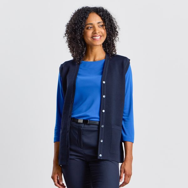Front View of a Women's Milano Knit Button Front Vest in French Navy, Featuring a Sleek Silhouette with Front Buttons, Complemented by a Rib Knit Boat Neck Top in a Matching Shade of Blue.