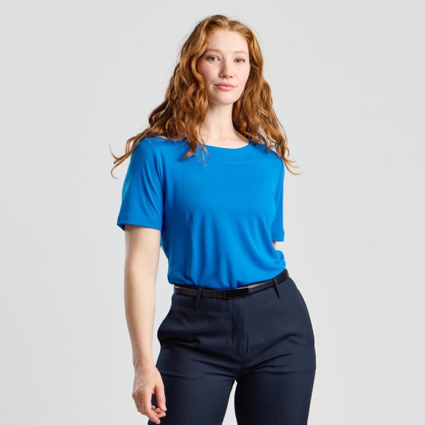Frontal View of a Model in a Marine Soft Knit Boat Neck Top, Hands by Her Side, Pairing with Navy Trousers.