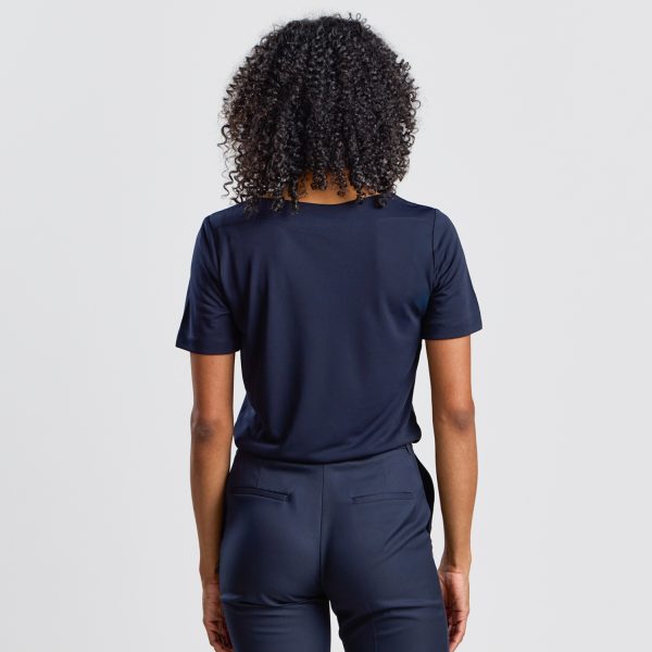 Back View of a Navy Soft Knit Boat Neck Top, Showing the Fit on the Model.