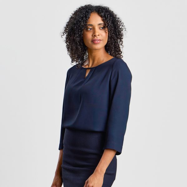 Profile View of a Model in a Navy Keyhole Blouse with 3/4 Sleeves, Pairing with a Form-fitting Navy Skirt.