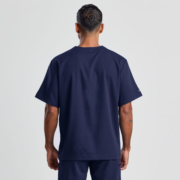 Rear View of the Men's Modern Scrub Top in Navy, Highlighting the Solid Back and Loose Fit for Comfort.