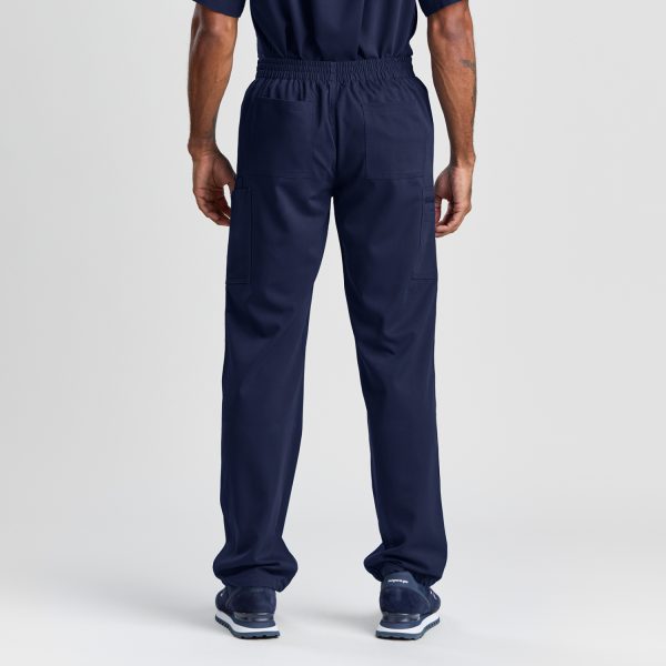 Rear View of Men's Modern Scrub Pant in Twilight Navy, Emphasizing the Pant's Ergonomic Design with Ample Pocket Space, Ideal for the Demands of Healthcare Work.