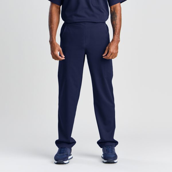 Front View of Men's Modern Scrub Pant in Twilight Navy, Showcasing a Relaxed Fit with Functional Design, Paired with Navy Blue Sneakers for a Complete Medical Uniform.