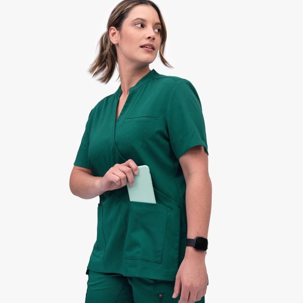 Designs to You Crossover Scrub Top Features Four Deep Pockets and a Flattering Cross Top.