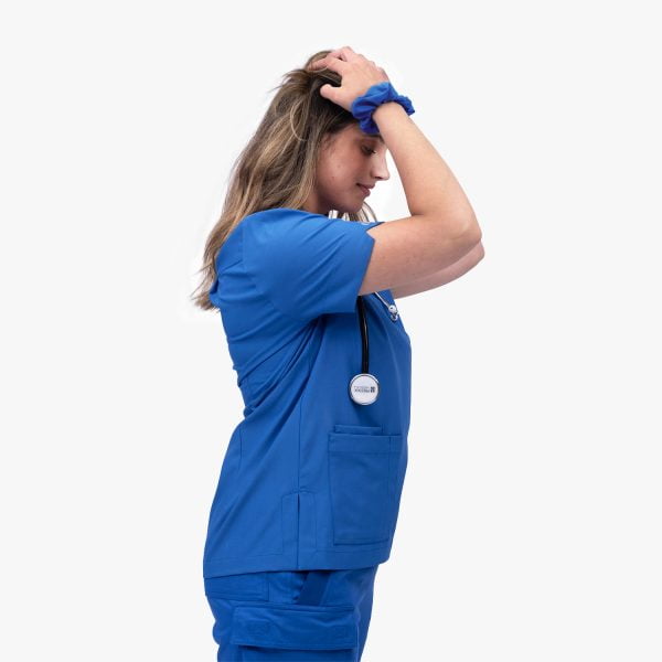 Side View Crossover Scrubs in Ocean Blue, Showcasing the Stylish Design.