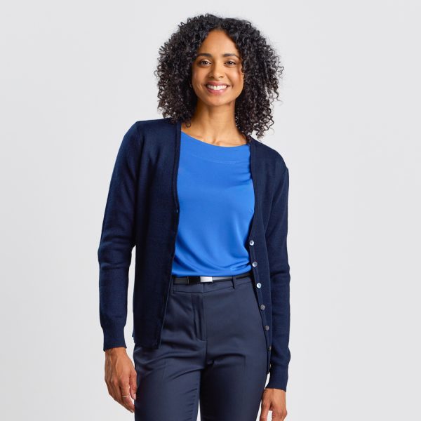 Front on View of a Woman in a French Navy Warm Knit Button Front Cardigan over a Blue Top.