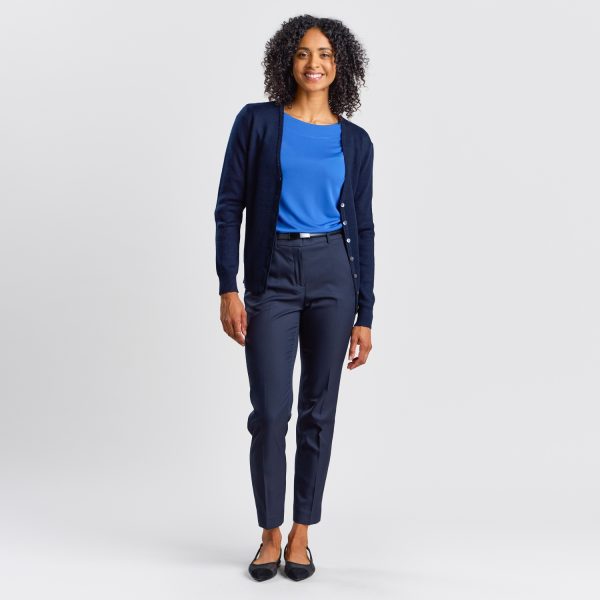 Full Body View of a Smiling Woman Facing Forward in French Navy Warm Knit Button Front Cardigan with Blue Top.
