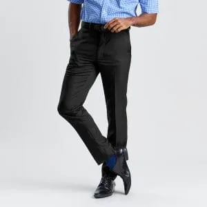 a Man Wearing Black Regular Fit Business Pants, a Blue Checked Shirt, a Black Leather Belt, and Black Shoes with Blue Socks, Against a Grey Background.