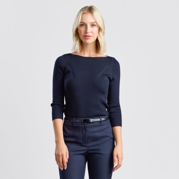 Front View of a Women's Rib Knit Boat Neck Top in French Navy, Showing the Subtle Texture and the Boat Neckline, Styled with Sleek Navy Pants for a Professional Look.