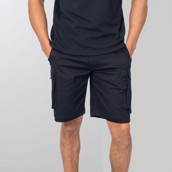 an Individual Wears Pair of Unisex Cargo Shorts in French Navy, Featuring Side Pockets for Utility and a Relaxed Fit, Perfect for Versatile, Everyday Wear.