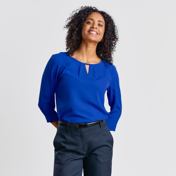 Close-up of a Woman in a Royal Blue Keyhole Blouse, Showcasing the Neckline Detail and Three-quarter Sleeves.