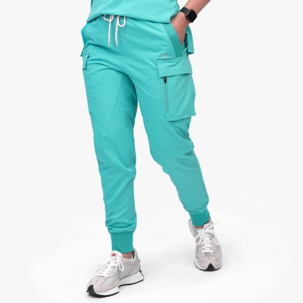 Front View of the Cargo Jogger Scrub Pant (final Sale), Featuring Six Pockets for Convenient Storage and a Four-way Stretch Fabric for Enhanced Flexibility and Comfort. the Image Showcases the Stylish Design and Functional Details of the Scrub Pant, Making It a Versatile and Practical Choice for Healthcare Professionals.