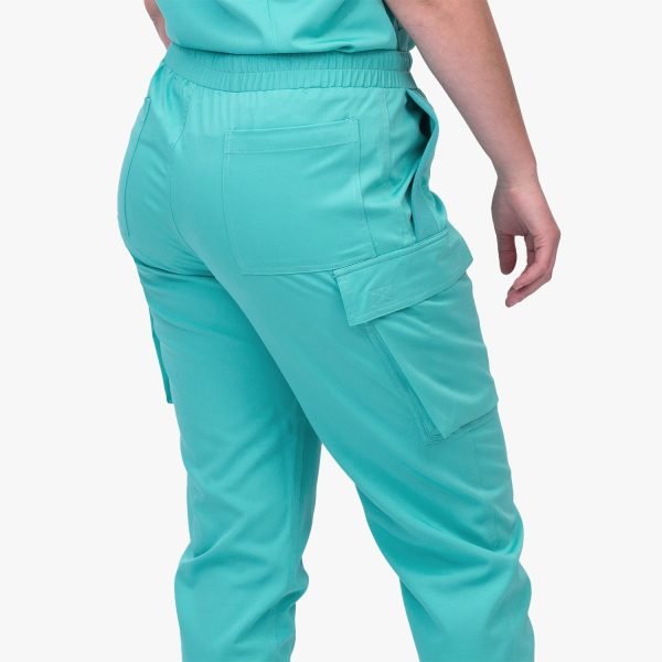 Side View of the Cargo Jogger Scrub Pant (final Sale), Featuring Six Pockets for Convenient Storage and a Four-way Stretch Fabric for Enhanced Flexibility and Comfort. the Image Showcases the Stylish Design and Functional Details of the Scrub Pant, Making It a Versatile and Practical Choice for Healthcare Professionals.