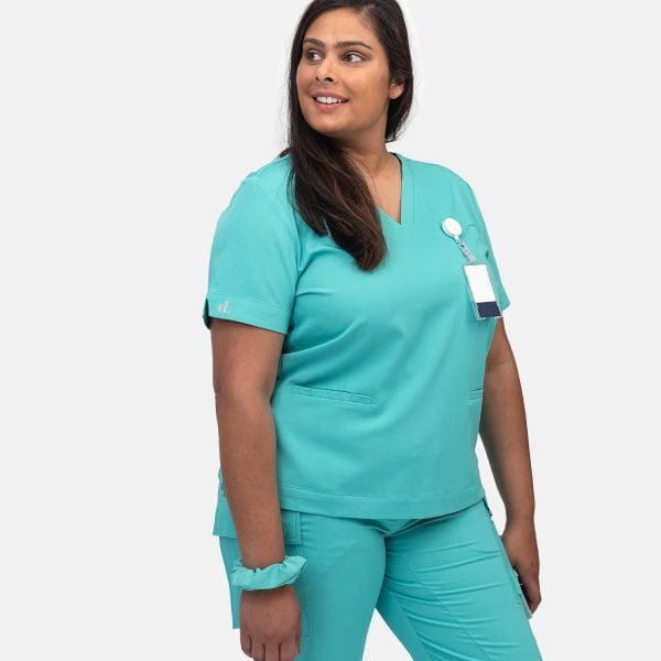 Women Wearing Designs to You Coolmint Scrubs, Showcasing Their Stylish Design and Functionality with Two Front Pockets. These Scrubs Are Currently on Final Sale, Offering a Great Opportunity to Grab Them at a Discounted Price.