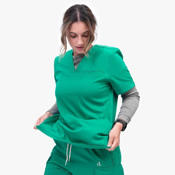 Women Confidently Wearing the Designs to You Og Green Modern Scrubs Top, Showcasing Its Functional Design with Three Deep Pockets and Four-way Stretch Fabric. the Scrubs Offer Both Style and Comfort, Making Them an Excellent Choice for Healthcare Professionals.