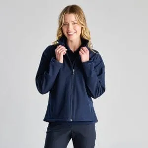 Front View of a Woman Smiling While Wearing a Navy Zip-up Softshell Jacket, Holding the Collar with Both Hands.