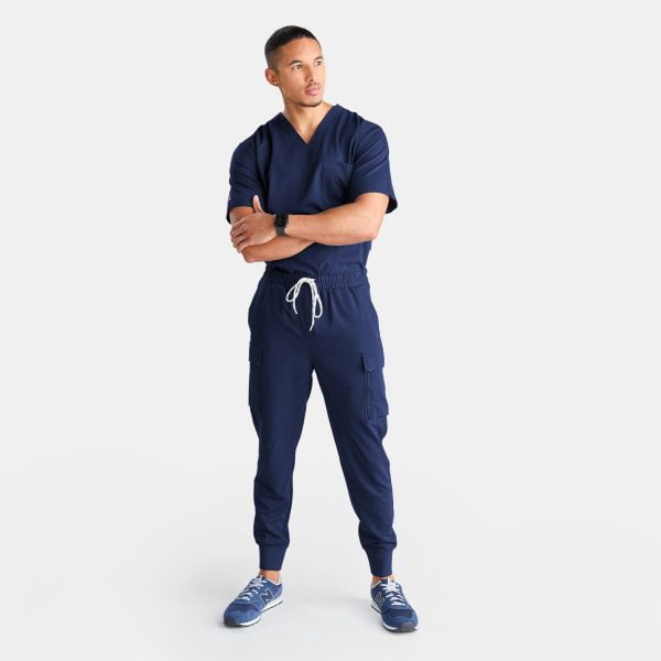 Full Body View of Man Wearing Unisex Cargo Jogger Scrub Pant in Twilight/navy by Designs to You