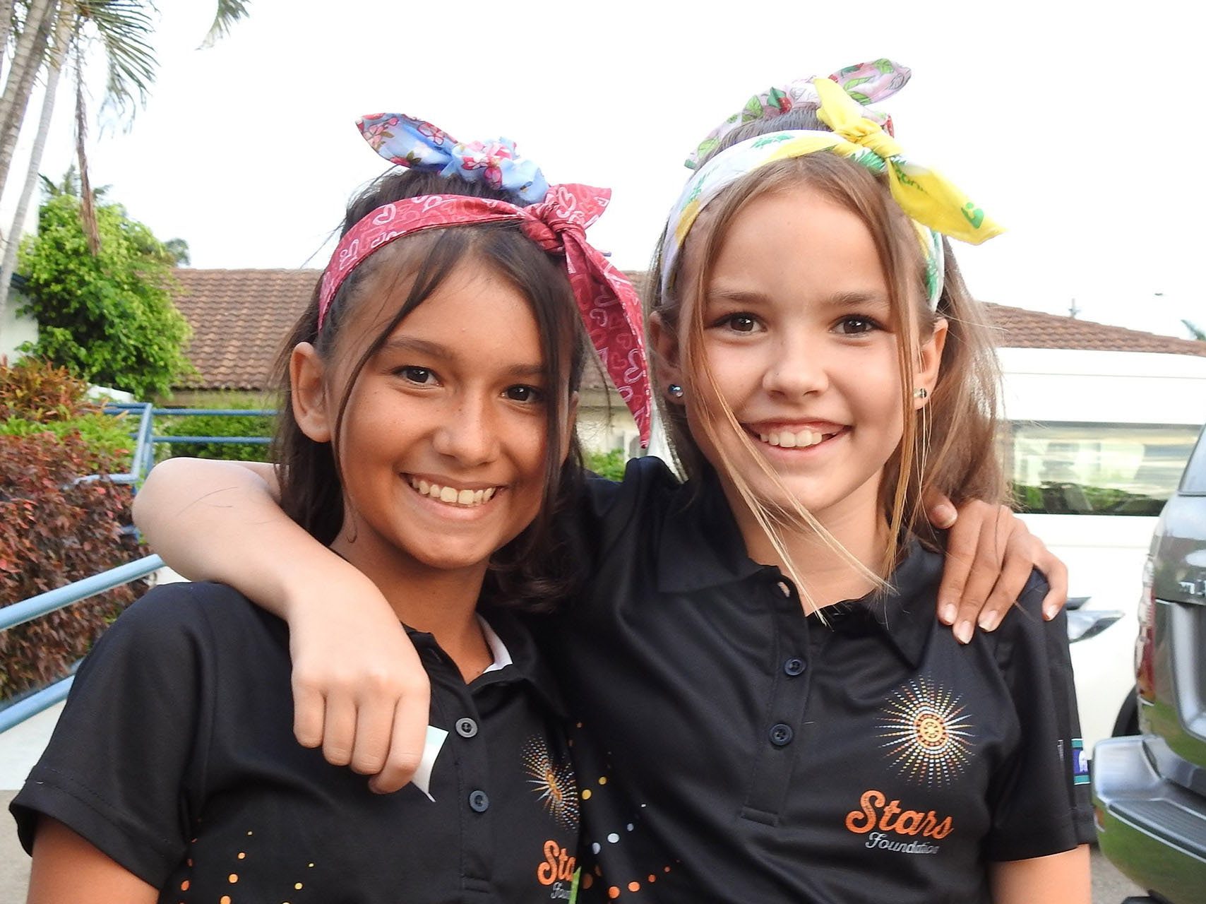an Image of Two Young Girls Wearing Shirts with the 'Star Foundation' logo.