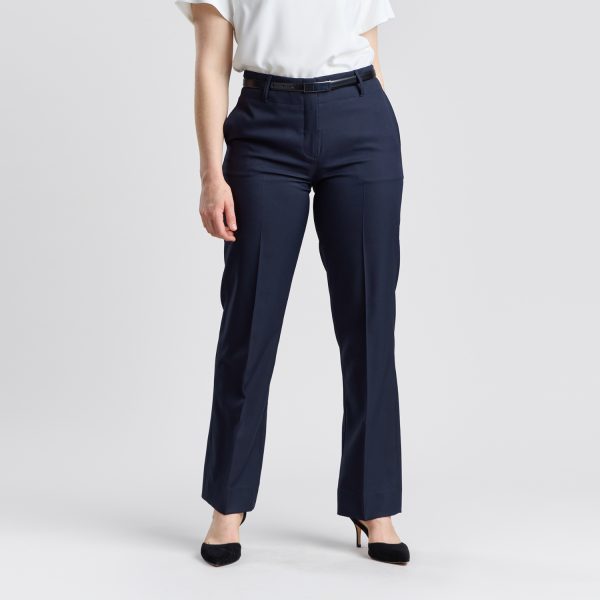 Front View of a Woman in Designs to You's Relaxed Leg Pant with Elastic Back in French Navy, Paired with a Black Belt and Heels.