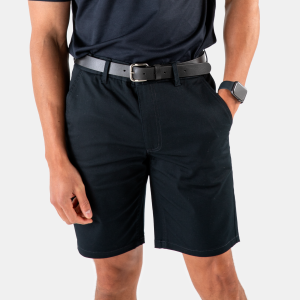 the Lower Half of a Man Dressed in Professional Attire, Featuring Dark Navy Chino Shorts Paired with a Black Belt by Designs to You. the Shorts Have a Relaxed Fit and Are Knee-length.
