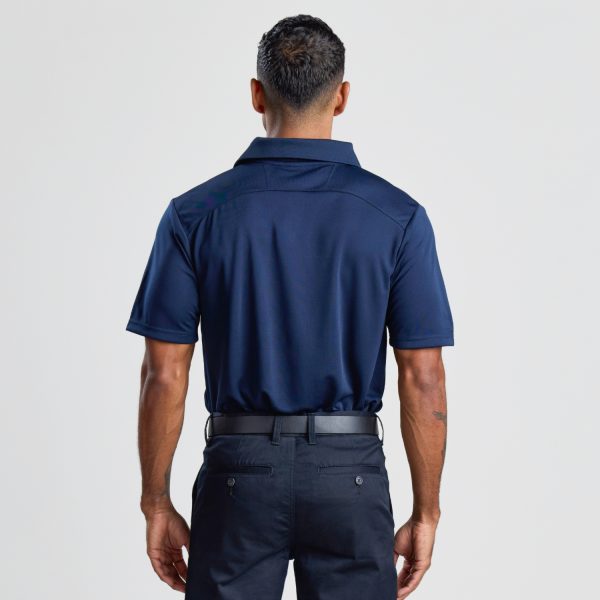 the Back View of a Man Wearing a Men's Eco Bamboo Polo in Navy, Highlighting the Shirt’s Back Seam and Collar.