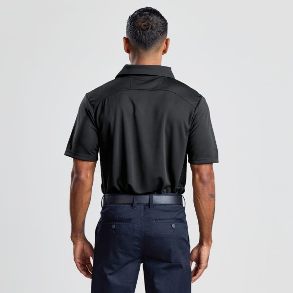 the Back View of a Man Wearing a Men's Eco Bamboo Polo in Black, Focusing on the Shirt's Straight Hem and Collar.