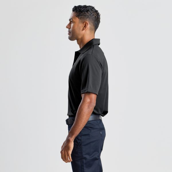a Side Profile of a Man Wearing a Men's Eco Bamboo Polo in Black, Highlighting the Shirt’s Fit and Sleeve Length.