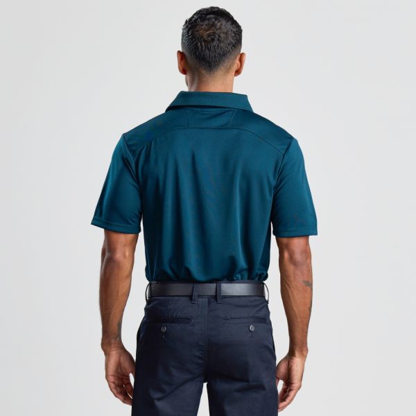 the Back View of a Man Wearing a Men's Eco Bamboo Polo in Ocean Blue, Displaying the Fit at the Shoulders and Waist.