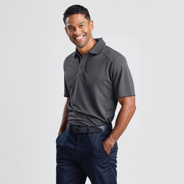 a Man Posing at an Angle in a Men's Eco Bamboo Polo in Storm Grey, Showing the Side Profile and Front of the Shirt.