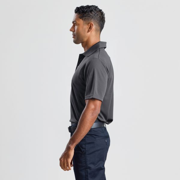a Side Profile of a Man Wearing a Men's Eco Bamboo Polo in Storm Grey, Showcasing the Fit and Sleeve Length.