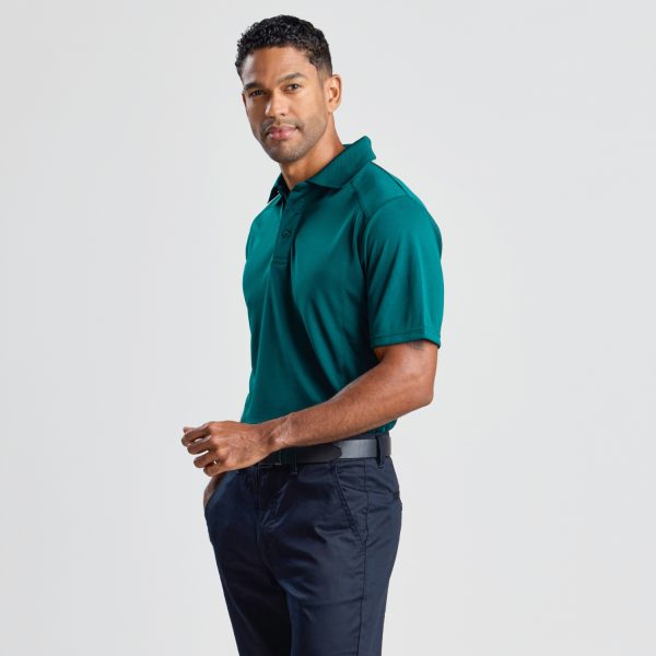 a Three-quarter Angle of a Man Wearing a Men's Eco Bamboo Polo in Teal, Highlighting the Shirt's Fit and Fabric Quality.