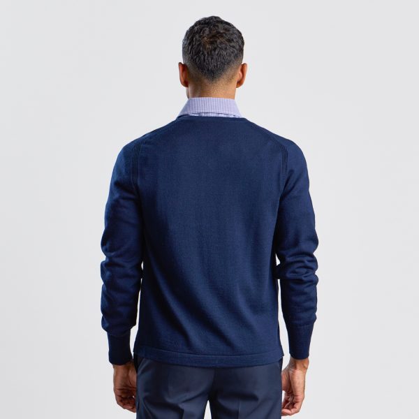 Rear View of a Man Wearing a Navy V-neck Pullover, Showing the Fit and Detailing on the Back.